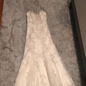 Ivory, lace, and beaded wedding gown